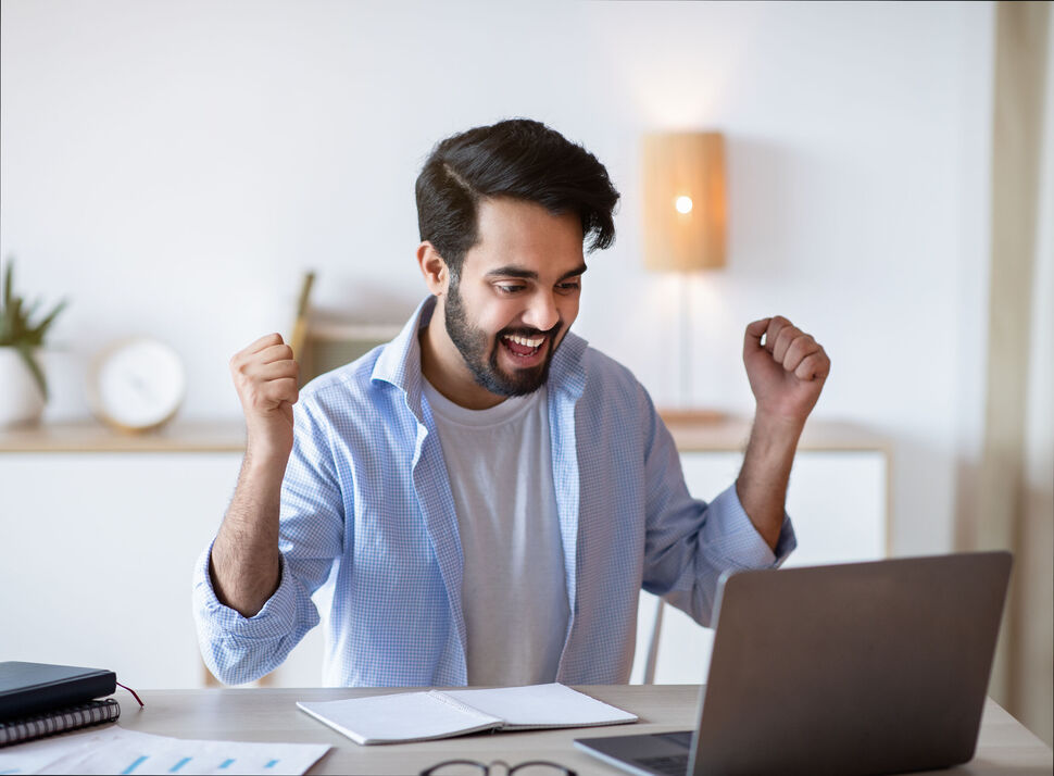 Promotion News. Overjoyed Arab Man Looking At Laptop Screen And Celebrating Success Happy online training participant